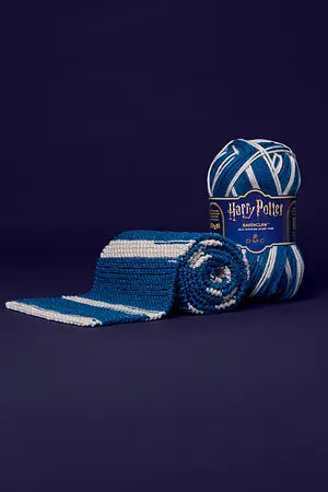 Ball of Sirdar Harry Potter™ Self-Striping Scarf Yarn in Ravenclaw™ colours, designed to knit an official Hogwarts-inspired striped scarf from a single 300g ball.